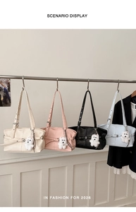 Detailed view of four colorful minimalist tote bags with cute bear charms for 2026 fashion