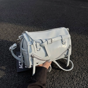 Modern glossy motorcycle bowling bag in light blue with silver zipper and belt details