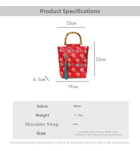 Detail showing dimensions of red embroidered bag with bamboo handle and blue tassel
