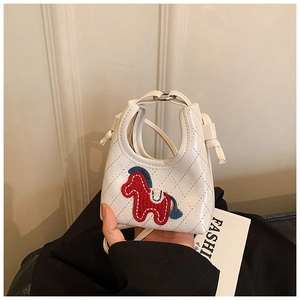 Detail of quilted creamy white PU leather mini bag with red horse embroidery and strap