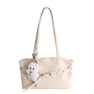 Chic beige tote bag with metallic buckle and cute white plush puppy charm pendant