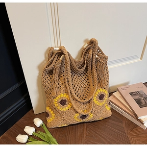 Macro shot of handcrafted woven sunflower tote bag with bohemian cotton textures
