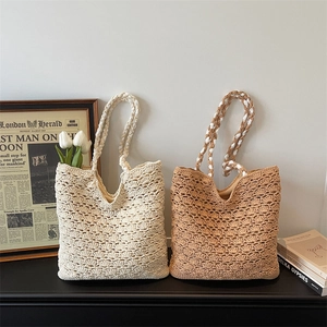 Handmade woven tote bag with hollow floral pattern in cream and light brown colors