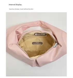 Internal view of pink faux leather bag featuring a zipper pocket and spacious main compartment