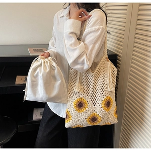 Detail of sunflower crochet tote bag with tassel and satin drawstring inner pouch