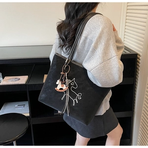 Chic black large capacity tote bag with horse embroidery and tassel charm for women