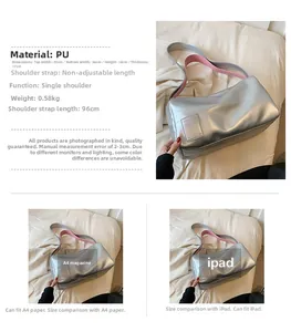 Detail of silver metallic pillow bag with wide pink strap and large capacity dimensions