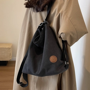 Large capacity black canvas tote bag for women with brown leather logo patch for commuting
