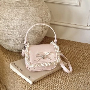 Pink sweet mini square bag with lace embroidery, silver bow, and black polka dot details