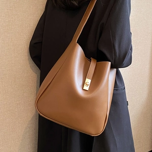Minimalist brown leather bucket bag with gold lock for autumn women's fashion