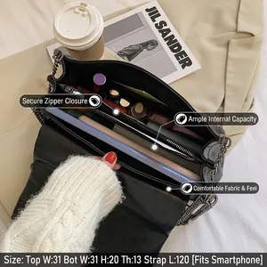 Grand sac fourre-tout en cuir noir avec bandoulière chaîne et intérieur spacieux pratique