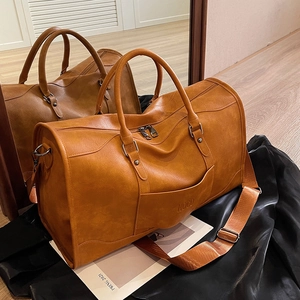 Large capacity vintage brown leather travel bag with dual handles and shoulder strap