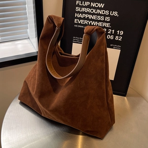 Large brown frosted suede hobo tote bag with stylish leather handles for women