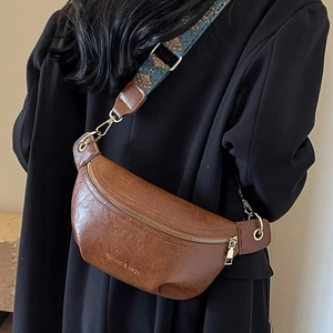Brown vintage half-moon crossbody bag with decorative geometric jacquard wide strap