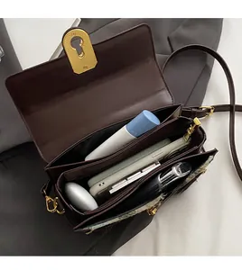 Top view of dark brown leather handbag showing spacious interior compartments and storage