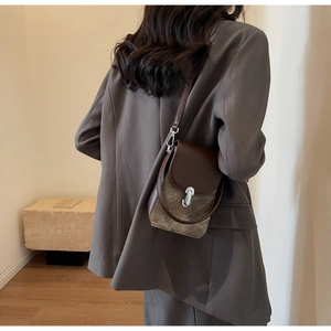 Retro crossbody phone bag with dark brown leather flap and stylish silver metal buckle