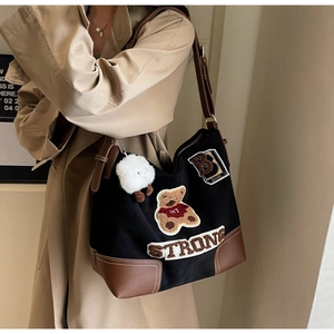Retro canvas tote bag with teddy bear embroidery and brown faux leather trim detail