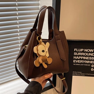 Women Litchi Grain PU Leather Bucket Bag Retro Handbag With Monkey Charm Adjustable Shoulder Strap Versatile Tote Bag
