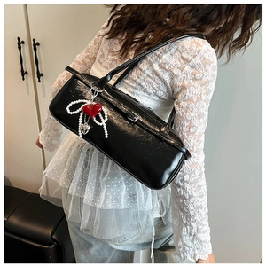 Glossy black patent leather shoulder bag with pearl heart charm pendant for women