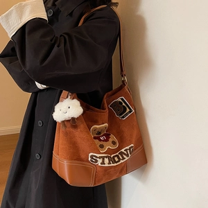 Brown suede tote bag with retro teddy bear embroidery and fuzzy cloud charm