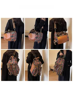 Detail view of large capacity vintage plaid travel backpack with leather handles and gold lock