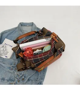 Detailed top view of large capacity vintage plaid travel bag showing spacious interior space