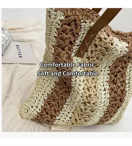 Close-up of woven straw bag showing striped texture and brown leather handle stitching