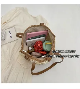 Spacious interior of woven straw tote bag holding an iPad, umbrella, and water bottle
