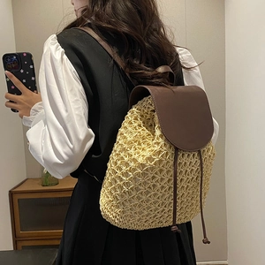 Large capacity woven straw backpack with brown leather straps for beach travel