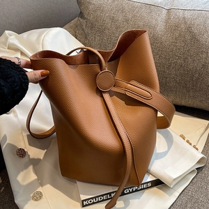 Brown litchi grain leather bucket bag with shoulder strap and stylish gold buckle detail