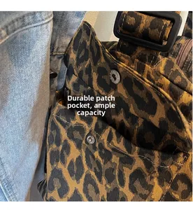 Close-up of leopard print canvas bag featuring a durable side pocket and snap button closure