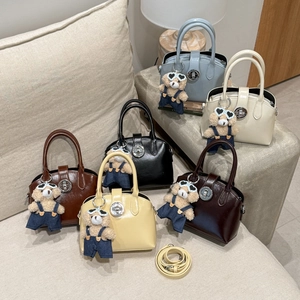 Selection of retro mini handbags in six colors with teddy bear charms and straps