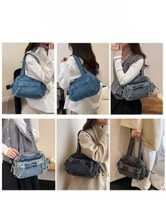 Close-up of vintage washed denim tote showing multiple carrying ways and Y2K aesthetic