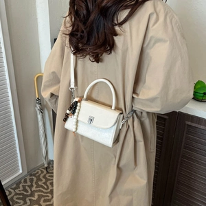 Creamy white crossbody small square bag with decorative wooden beads and silver metal buckle