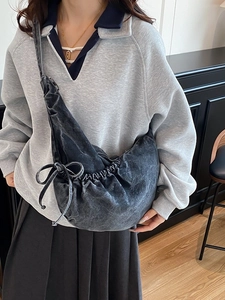 Chic black washed denim crossbody bag with multi-pocket design for casual daily use