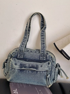 Retro washed denim blue shoulder bag with multiple pockets and vintage faded texture design