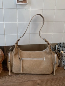 Chic khaki suede dumpling handbag with multi-pocket design and silver hardware details