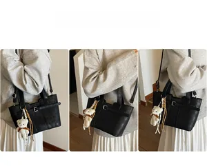 Lifestyle shots of black PU bucket bag with buckle detail and plush bear charm