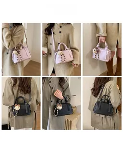 Detail shots of black and pink faux leather tote bags with cute bear charms on a model