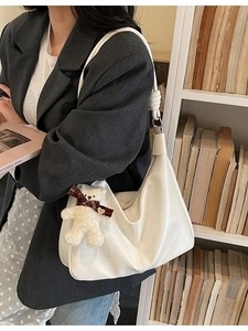 White soft leather hobo shoulder bag for women with a cute plush bear pendant accessory