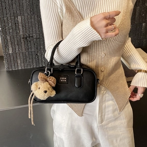 Classic black PU leather satchel with dual handles and plush bear charm for daily commuting