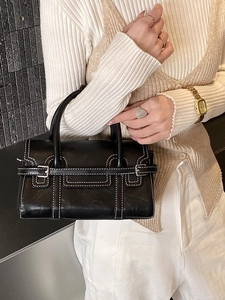 Elegant black leather handbag for women featuring stylish white contrast stitching details