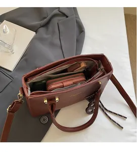 Top view of red brown leather handbag showing spacious interior for wallet and phone