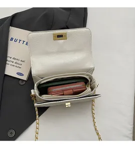 Macro view of the multi-layer interior storage for the quilted chain shoulder bag
