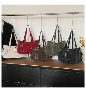 Detail view of large vintage tote bags in five colors with multi-pocket suede texture