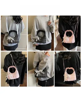 Detail shots of plaid cloud bag with large bow, lace texture and heart pendant charm
