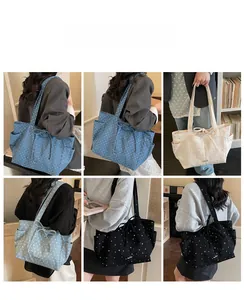 Detailed views of multi-color canvas tote bags with polka dots and side drawstring bows