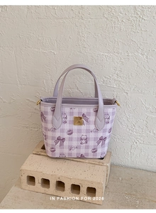 Detailed view of lavender checkered mini tote with cute cartoon cat and heart prints