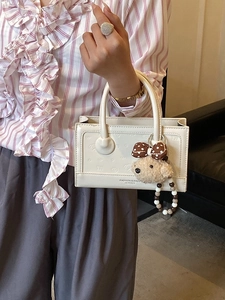 Elegant white square handbag with cartoon embossing and plush bear charm for women