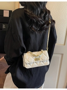 Elegant white quilted crossbody chain bag with gold metal twist lock and stylish top handle